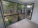 Screened balcony overlooking a wooded area at 196 Riverbend Dr # 204, Altamonte Springs, FL 32714
