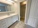 Bright bathroom with white vanity, large mirror, and shower/tub combo at 196 Riverbend Dr # 204, Altamonte Springs, FL 32714