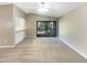 Spacious living room with carpeting and access to the balcony at 196 Riverbend Dr # 204, Altamonte Springs, FL 32714