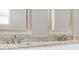 Double vanity bathroom with granite countertop and modern fixtures at 530 Ellie Ct, Apopka, FL 32703