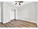 Bedroom with ceiling fan, closet, and light flooring at 530 Ellie Ct, Apopka, FL 32703