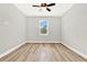 Bright bedroom with ceiling fan and window at 530 Ellie Ct, Apopka, FL 32703