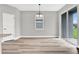 Bright dining area with sliding glass doors leading to a backyard at 530 Ellie Ct, Apopka, FL 32703