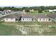 Aerial view of three homes, showcasing their backyards and landscaping at 530 Ellie Ct, Apopka, FL 32703