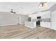 Open kitchen with island, stainless steel appliances, and white cabinets at 530 Ellie Ct, Apopka, FL 32703