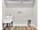 Laundry room with utility sink and built-in shelving at 530 Ellie Ct, Apopka, FL 32703