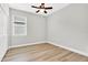 Bedroom with ceiling fan, window, and neutral decor at 530 Ellie Ct, Apopka, FL 32703