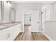 Bathroom with granite countertop, white cabinets, and a walk-in shower at 530 Ellie Ct, Apopka, FL 32703