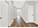 Bright hallway with wood-look floors and white doors at 524 Ellie Ct, Apopka, FL 32703