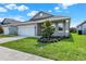 Front view of a single story house with landscaping at 524 Ellie Ct, Apopka, FL 32703