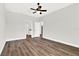 Spacious bedroom with wood-look flooring and access to bathroom at 524 Ellie Ct, Apopka, FL 32703