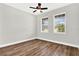 Spacious bedroom with wood-look flooring and two windows at 524 Ellie Ct, Apopka, FL 32703