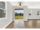 Bright dining room with sliding glass doors leading to backyard at 524 Ellie Ct, Apopka, FL 32703