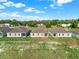 Three new homes with gray exteriors and brown roofs, viewed from behind at 524 Ellie Ct, Apopka, FL 32703