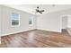 Spacious living room with wood-look floors and ceiling fan at 524 Ellie Ct, Apopka, FL 32703