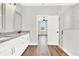 Elegant bathroom boasts double vanity and access to bedroom at 524 Ellie Ct, Apopka, FL 32703