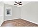 Light-filled bedroom featuring a ceiling fan and vinyl plank flooring at 524 Ellie Ct, Apopka, FL 32703