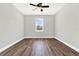 Charming bedroom with wood-look flooring and window at 524 Ellie Ct, Apopka, FL 32703