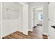 Large walk-in closet with wood-look flooring and built-in shelving at 524 Ellie Ct, Apopka, FL 32703