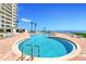 Outdoor pool with ocean views and lounge chairs at 2545 S Atlantic Ave # 2107-2108, Daytona Beach Shores, FL 32118