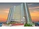 Tall white building with many windows and balconies at sunset at 2545 S Atlantic Ave # 2107-2108, Daytona Beach Shores, FL 32118