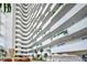 High-rise building's atrium lobby with balconies and plants at 2545 S Atlantic Ave # 2107-2108, Daytona Beach Shores, FL 32118