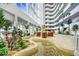 High-rise building lobby with a water feature and tropical plants at 2545 S Atlantic Ave # 2107-2108, Daytona Beach Shores, FL 32118
