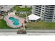 Aerial view of resort-style pool with surrounding lounge chairs and beach access at 2545 S Atlantic Ave # 2107-2108, Daytona Beach Shores, FL 32118