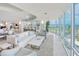 Bright living room with floor-to-ceiling windows and ocean views at 2545 S Atlantic Ave # 2107-2108, Daytona Beach Shores, FL 32118