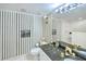 Bathroom with shower and tiled walls at 2545 S Atlantic Ave # 2107-2108, Daytona Beach Shores, FL 32118