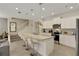 Modern kitchen featuring granite countertops, stainless steel appliances, and an island with seating at 4270 Lana Ave, Davenport, FL 33897