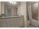 Bathroom with granite countertops, double sinks, and a bathtub at 4270 Lana Ave, Davenport, FL 33897