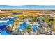 Aerial view of community pool, water features, and surrounding homes at 4270 Lana Ave, Davenport, FL 33897