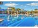 Large resort-style pool with plenty of lounge chairs for relaxation at 4270 Lana Ave, Davenport, FL 33897