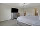 Bedroom with large bed, dresser, and TV at 4270 Lana Ave, Davenport, FL 33897