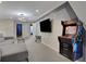 Spacious game room featuring a classic arcade game, large TV, and comfortable seating at 4270 Lana Ave, Davenport, FL 33897