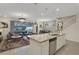 Open concept kitchen with island, stainless steel appliances, and view of living room at 4270 Lana Ave, Davenport, FL 33897