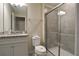 Clean bathroom with granite countertop, toilet, and a large shower at 4270 Lana Ave, Davenport, FL 33897