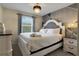 Elegant bedroom with a king-size bed, stylish decor and en-suite bathroom at 4270 Lana Ave, Davenport, FL 33897