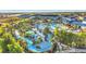 Aerial view of community pool, lazy river, and surrounding homes at 4270 Lana Ave, Davenport, FL 33897