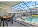 Enjoy this private pool and patio area with grill and dining table at 4270 Lana Ave, Davenport, FL 33897