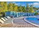 Pool area with private cabanas and lounge chairs at 4270 Lana Ave, Davenport, FL 33897