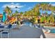 Resort-style pool with a wooden footbridge and lounge chairs at 4270 Lana Ave, Davenport, FL 33897