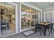 Outdoor patio with glass doors leading to the living room and kitchen at 4270 Lana Ave, Davenport, FL 33897