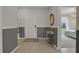 Open entryway with gray and white color scheme and view to the kitchen and bedroom at 4270 Lana Ave, Davenport, FL 33897