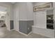 Bright entryway with built-in bench, storage, and gray-and-white decor at 4270 Lana Ave, Davenport, FL 33897