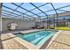 Enjoy this private screened pool and patio area, complete with lounge chairs and a grill at 4270 Lana Ave, Davenport, FL 33897