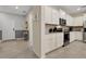 Modern kitchen with white cabinets, granite counters, and stainless steel appliances at 4270 Lana Ave, Davenport, FL 33897