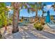 Relaxing hammock area with white sand and palm trees at 4270 Lana Ave, Davenport, FL 33897