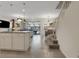 Open concept kitchen with granite island, modern lighting, and view into Gathering room and pool at 4270 Lana Ave, Davenport, FL 33897